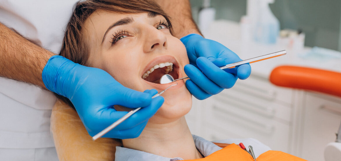 Female patient sitting dentist chair making professinal hygiene