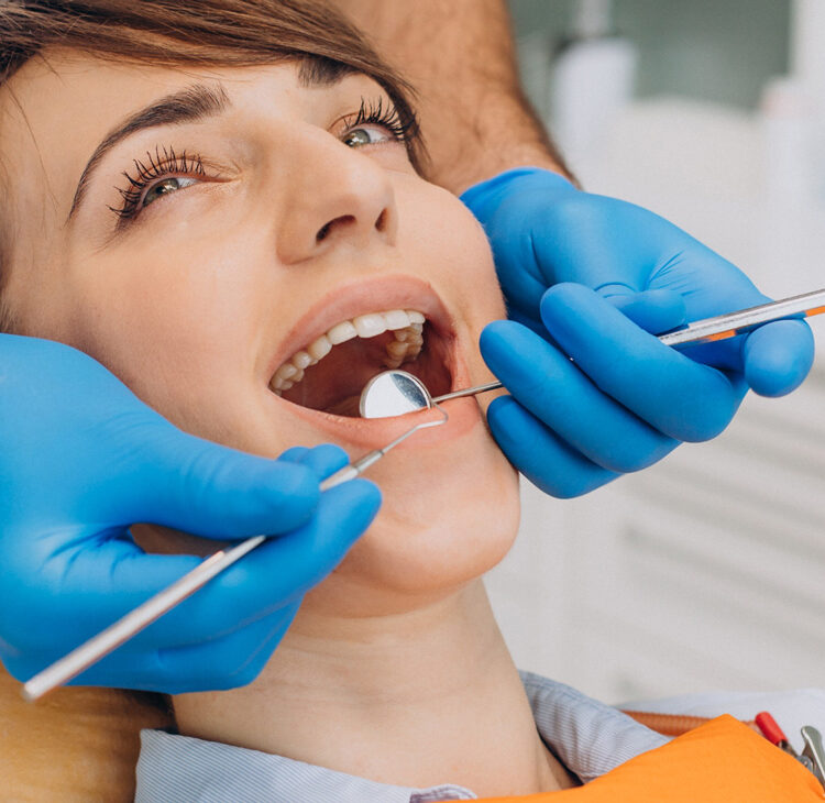 Female patient sitting dentist chair making professinal hygiene